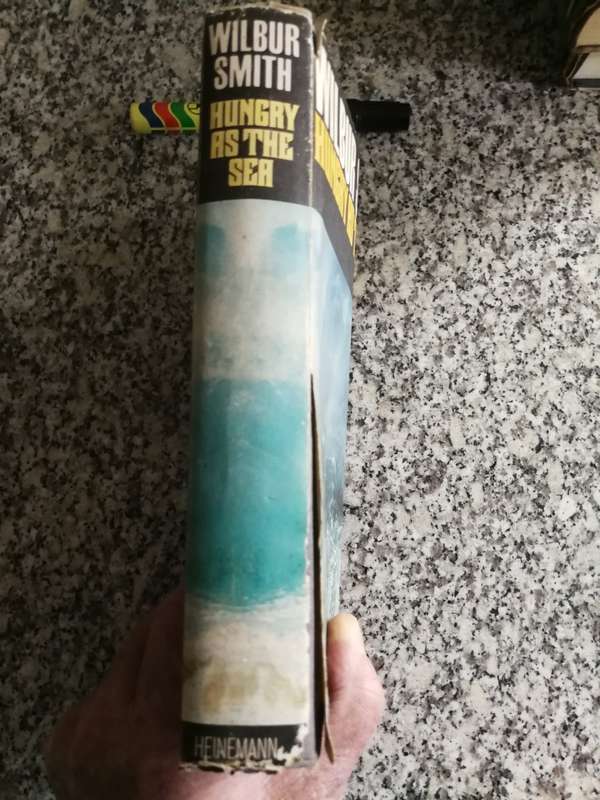 WILBUR SMITH HUNGRY AS THE SEA HEINEMAN 1978 Reprint  Edition