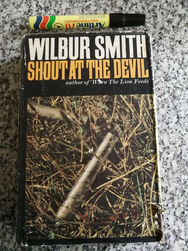 WILBUR SMITH SHOUT AT THE DEVIL  HEINEMAN 1978 First Edition 1968