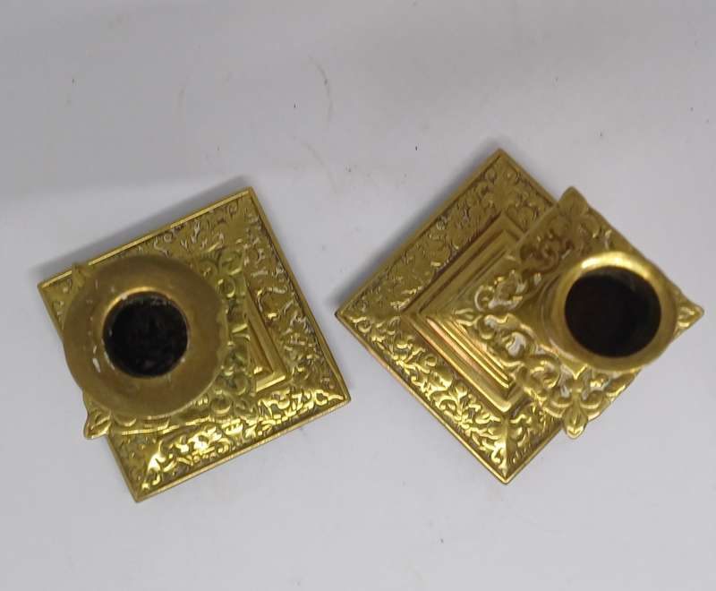 Two brass candle holders