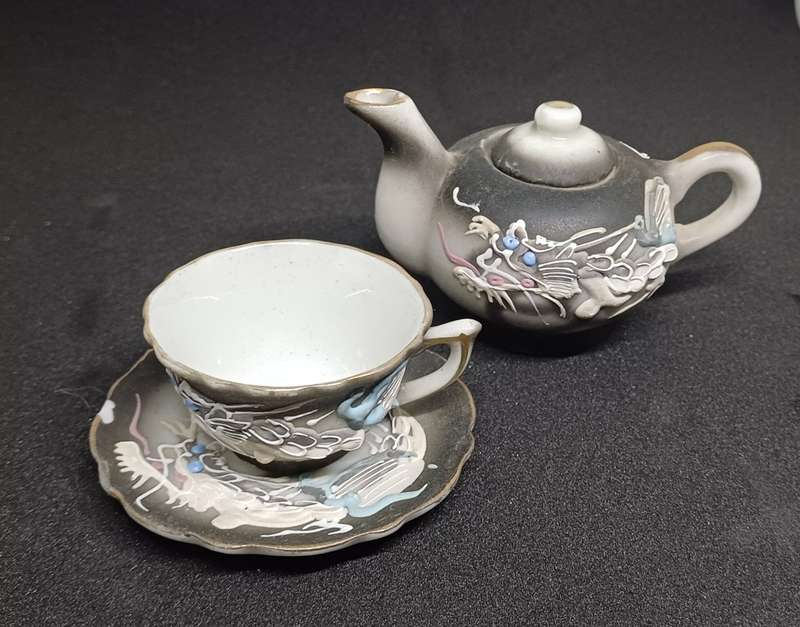 Miniature teapot and teacup