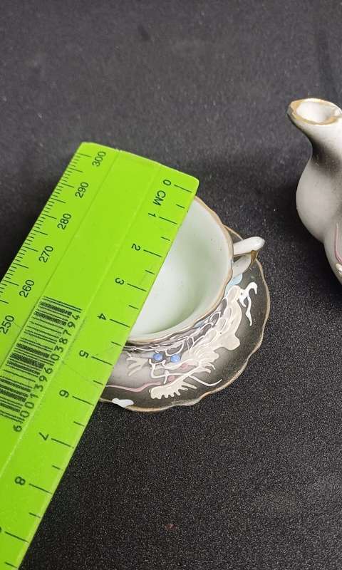 Miniature teapot and teacup