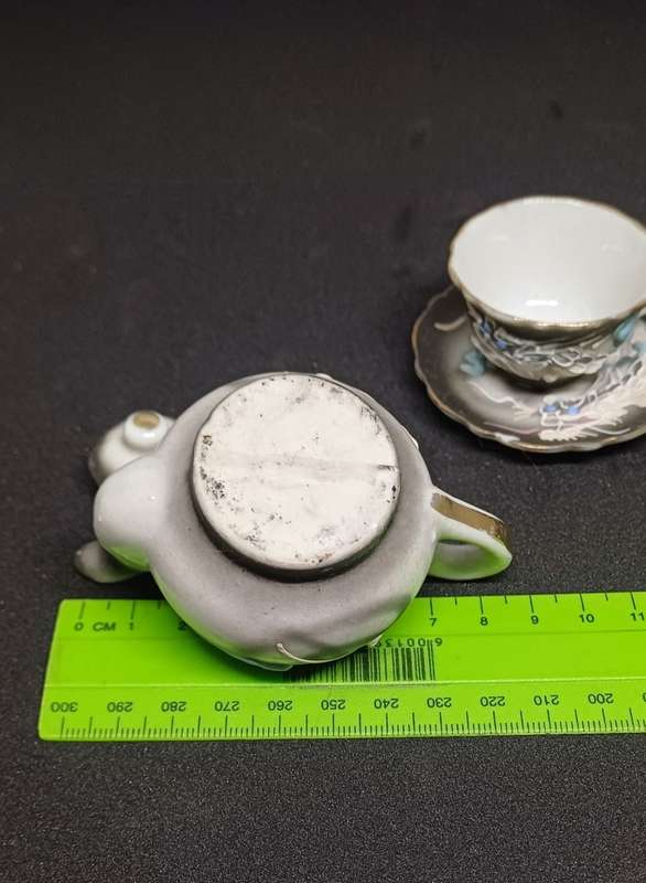 Miniature teapot and teacup