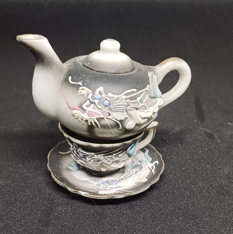 Miniature teapot and teacup