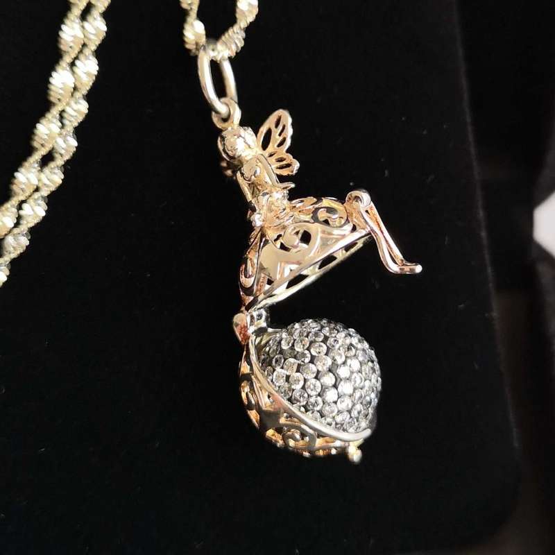 Beautiful Twisted Sterling Silver Necklace with Angel Pendant Locket holding a tiny Crystal Ball