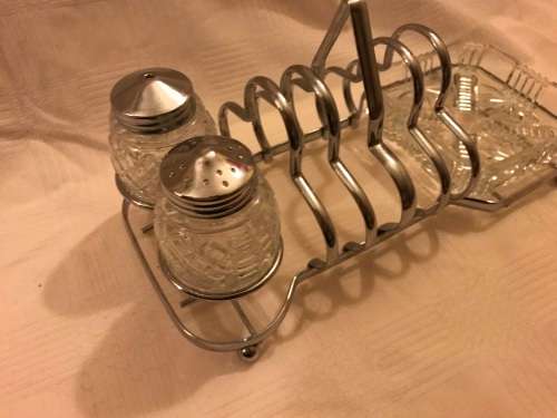 Chromed toast rack with butter dish and shares