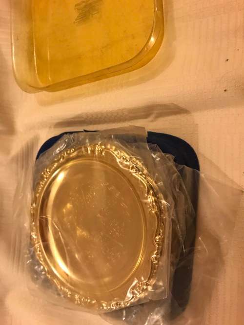 Set of brass coasters for auction