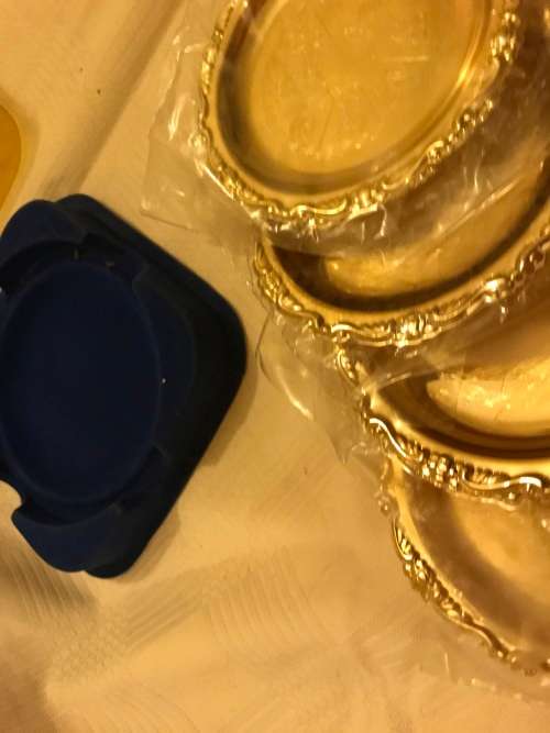 Set of brass coasters for auction