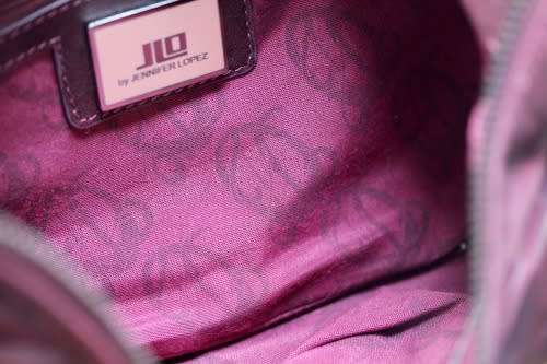 GENUINE JENNIFER LOPEZ (JLO) BURGUNDY ORIGINAL LEATHER 'HOBO' HANDBAG WITH TASSEL DETAILS.
