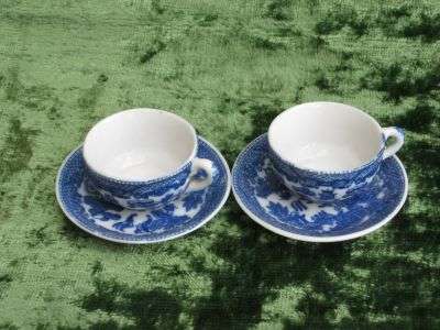 Two tea set cups and saucers