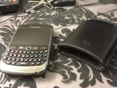 Blackberry Curve 8900 with cover and a box