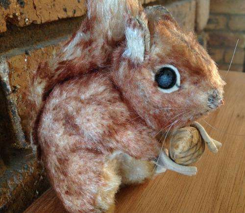 Vintage straw stuffed squirrel