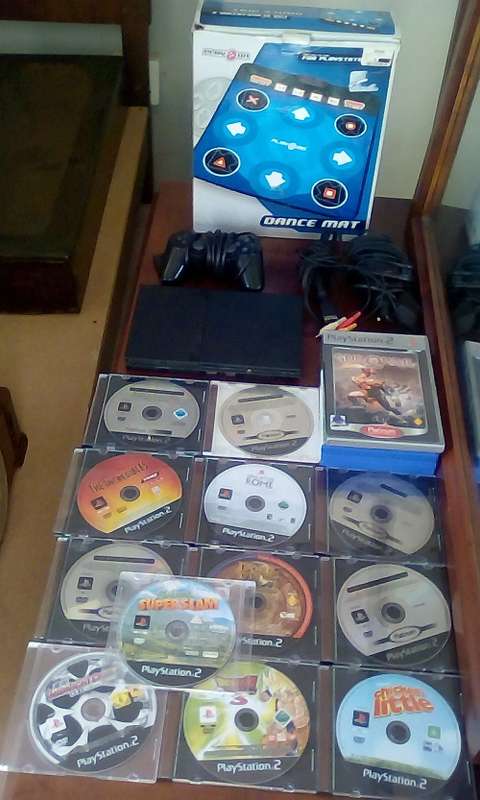 PlayStation 2 Console + Dance Mat + 1 Controller + Power Cable + RCA Cable + 16 Games
