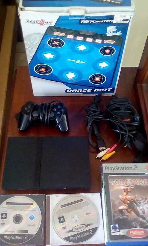 PlayStation 2 Console + Dance Mat + 1 Controller + Power Cable + RCA Cable + 16 Games