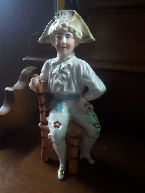 Vintage Handpainted Ceramic Figure Of Man On a Chair