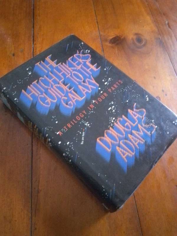 1986 1st Edition `The Hitch Hikers Guide To the Galaxy` Trilogy in four parts Hardcover