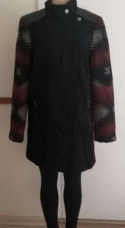 Classic black zip up coat with beautiful print sleeves