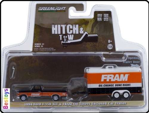 Greenlight Diecast Model Car Set Hitch and Tow Ford F 150 F150 XLT Pickup 1994 + Car Trailer `Fram`