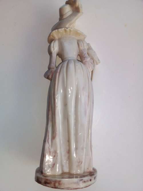 Vintage - Women with parrot on shoulder figurine.