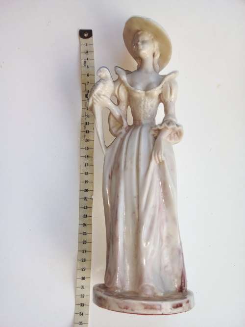 Vintage - Women with parrot on shoulder figurine.