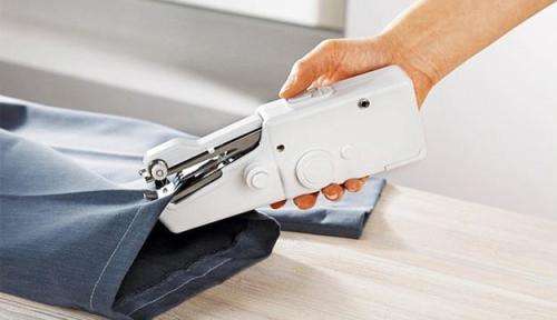 Handheld sewing machine