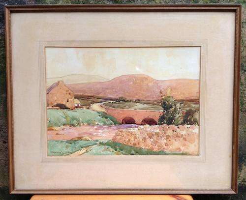 **VALUABLE**Maurice C Wilkes (Irish - 1910 - 1984) - WC of a landscape (56x46cm) Framed behind glass
