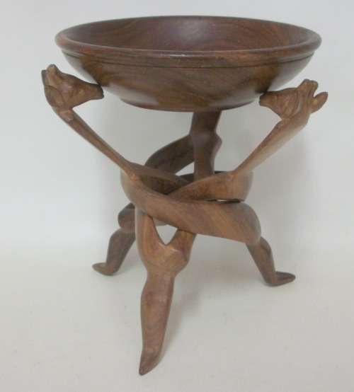 Interlocking carved stand with giraffe heads, supporting wooden bowl - 20cm tall