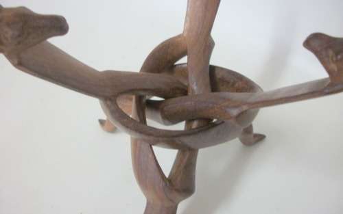 Interlocking carved stand with giraffe heads, supporting wooden bowl - 20cm tall