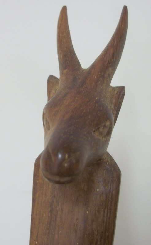 Beautifully Carved Stand with Buck Heads, supporting wooden bowl