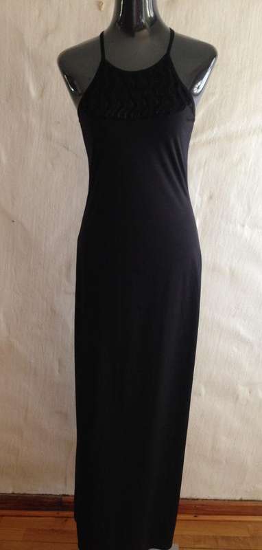 BEAUTY IN THE SIMPLICITY OF THIS BLACK HALTER-NECK DRESS
