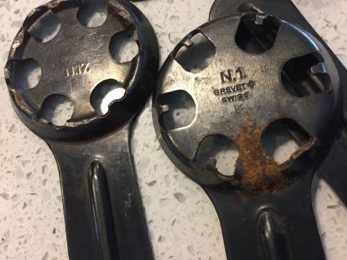 Vintage watch case openers