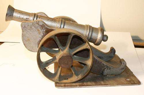 Old Steel Cannon with Brass Wheels