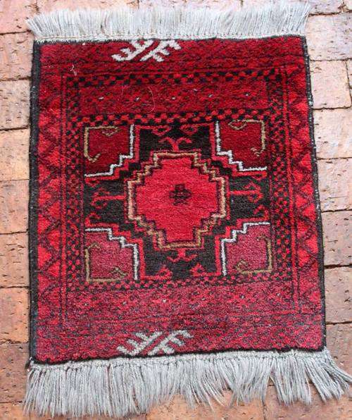 A beautiful small hand-knotted Afghan Oriental rug