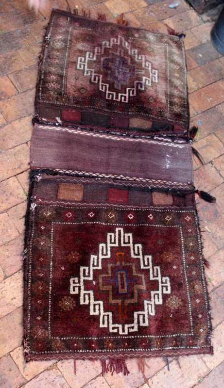 Hand knotted Persian camel saddle bags in very fashionable distressed condition 140cm x 61cm