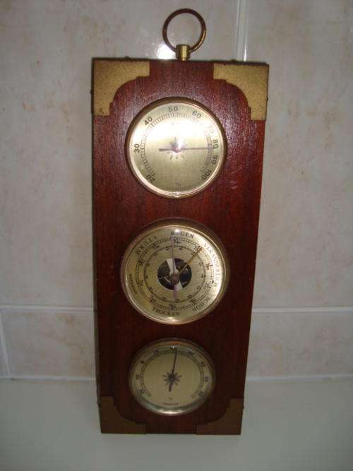 THERMOSTAR, BAROSTAR and a HYGROSTAR mounted on wood