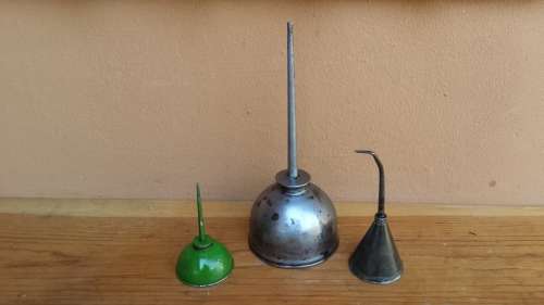 Collection of 3 thumb press oil cans.