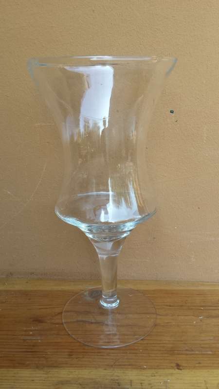 Large stemmed glass vase.