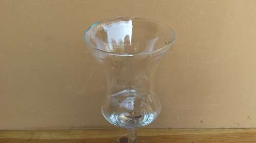 Large stemmed glass vase.
