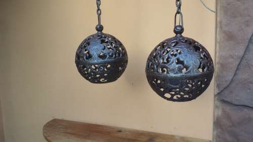 Pair of old cast iron ball ceiling lights.