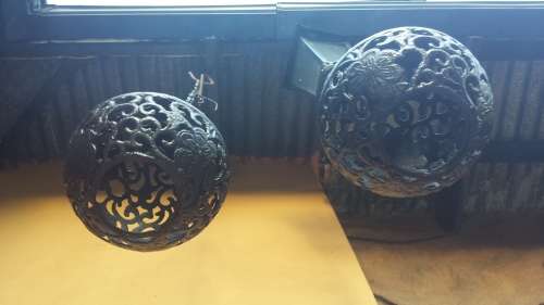 Pair of old cast iron ball ceiling lights.