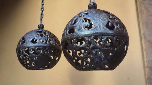 Pair of old cast iron ball ceiling lights.