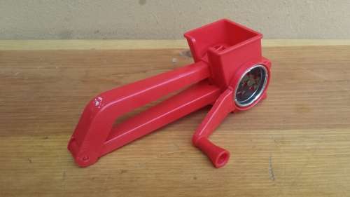 Lovely red plastic hand grater.