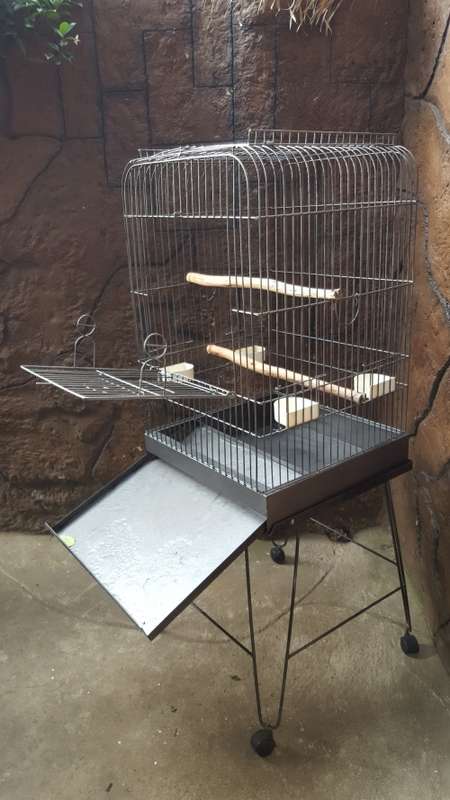 Lovely, large parrot cage on a stand.