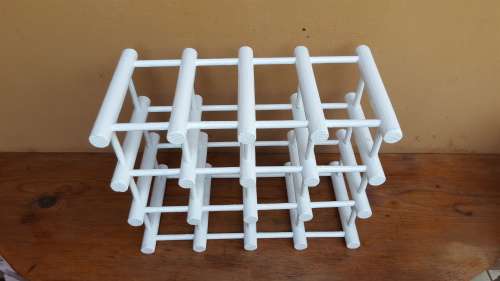 Old white wooden wine bottle holder.