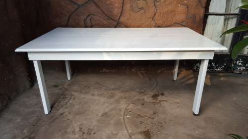 Lovely, large white, wooden table.