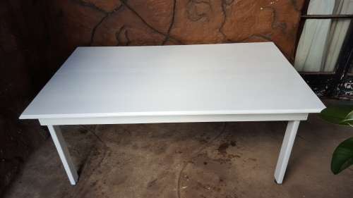 Lovely, large white, wooden table.