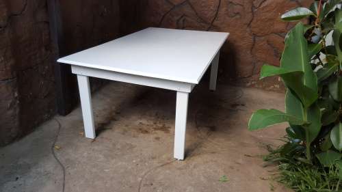 Lovely, large white, wooden table.