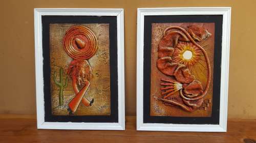 Beautiful pair of signed art pieces.