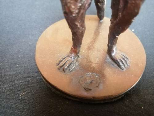 Solid bronze meerkat sculpture by Sarah Richards.