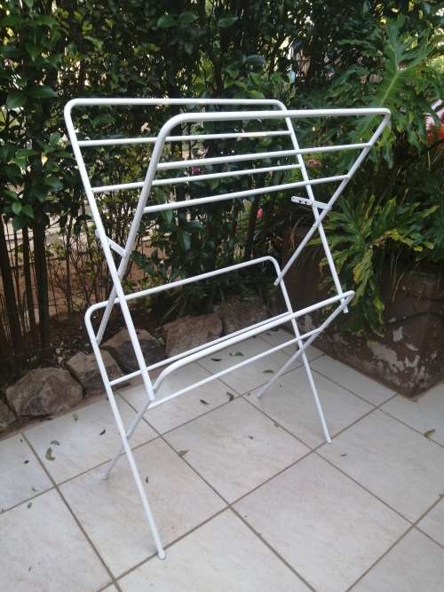 Old metal fold up clothes dryer.