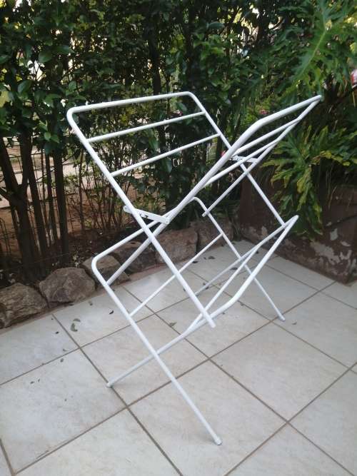 Old metal fold up clothes dryer.